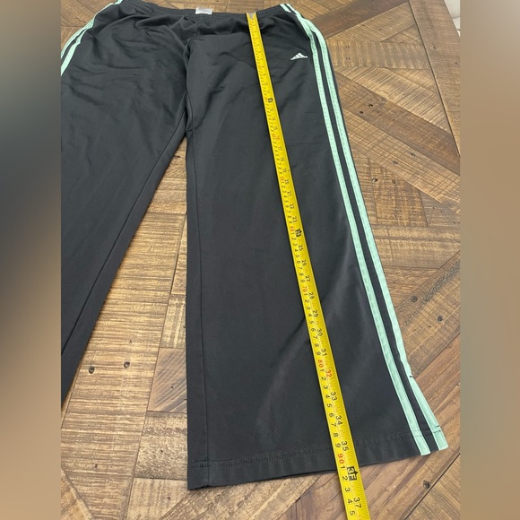 women's black Adidas track pants with mint or light green stripes - Picture 5 of 6